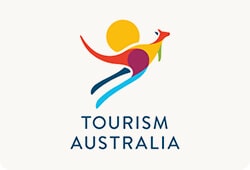 Tourism Australia - Canberra Guided Tours Stylised multicoloured kangaroo made from abstract shapes with a yellow sun behind it above the words TOURISM AUSTRALIA